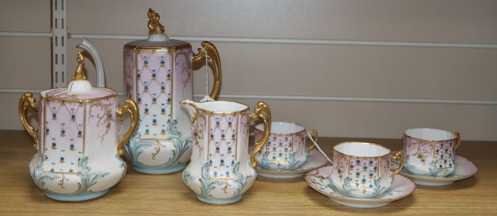 A Limoges porcelain part coffee service, with floral decoration heightened in gilt (9 pieces), coffee pot H.23cm